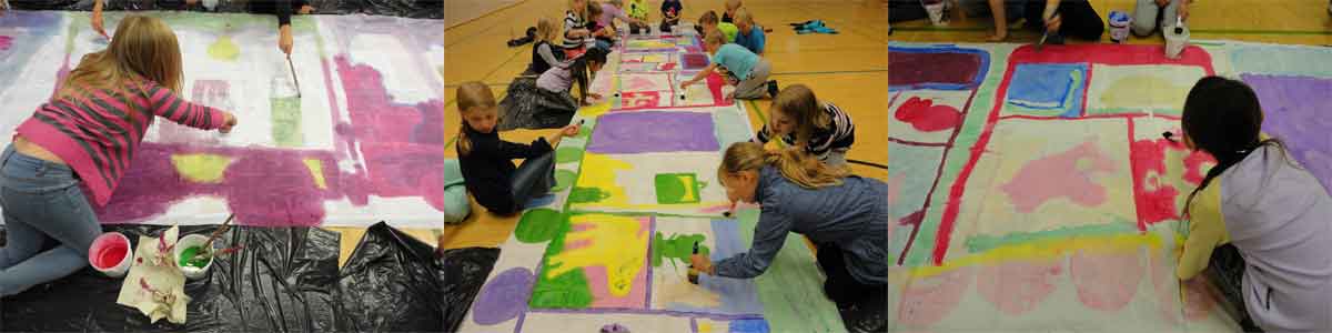 children are painting a huge train